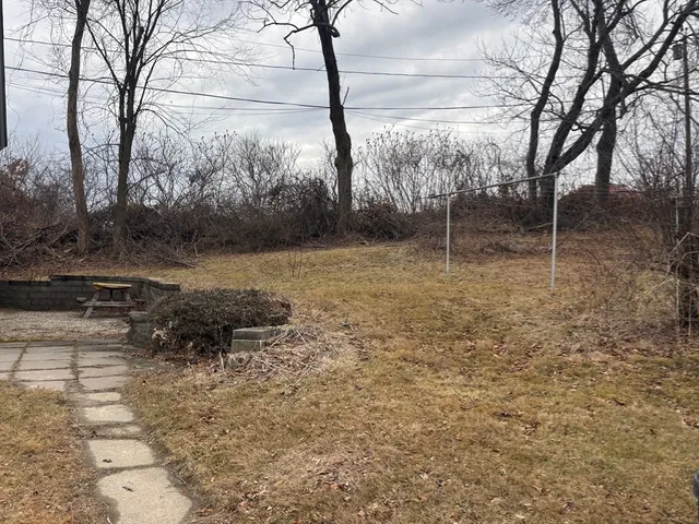 a backyard of a house with lots of green space