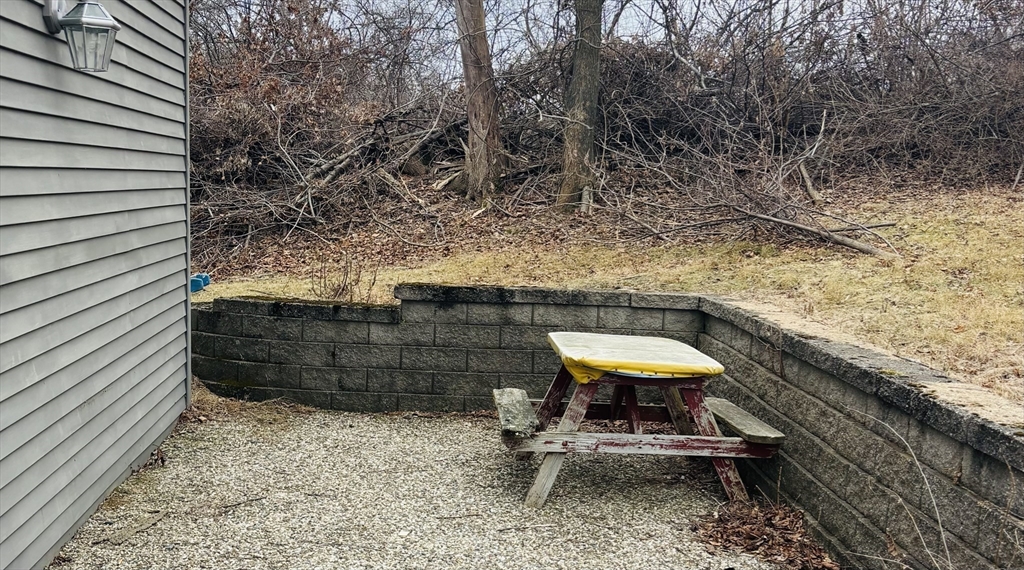 316 Amesbury Road Haverhill, MA 01830 - Photo 27 of 28 a bathroom with a toilet and a chair