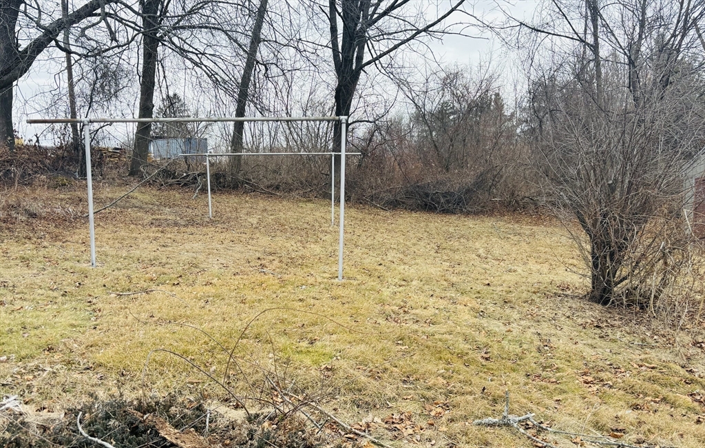 316 Amesbury Road Haverhill, MA 01830 - Photo 28 of 28 a backyard of a house with lots of green space