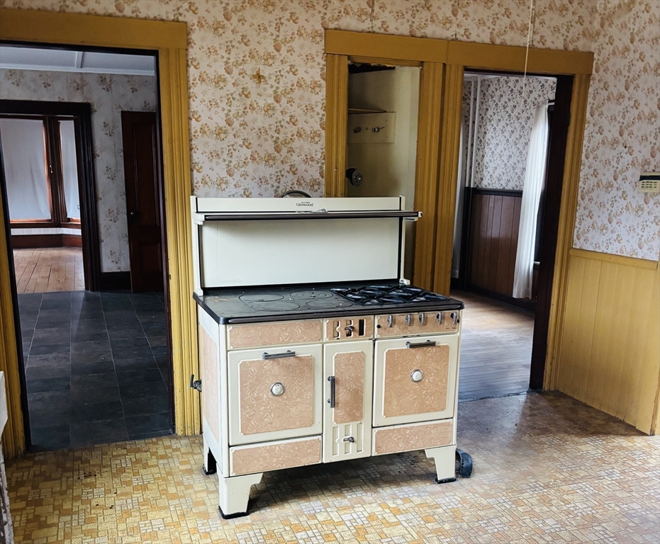 316 Amesbury Road Haverhill, MA 01830 - Photo 3 of 28 a living room with a stove and a refrigerator