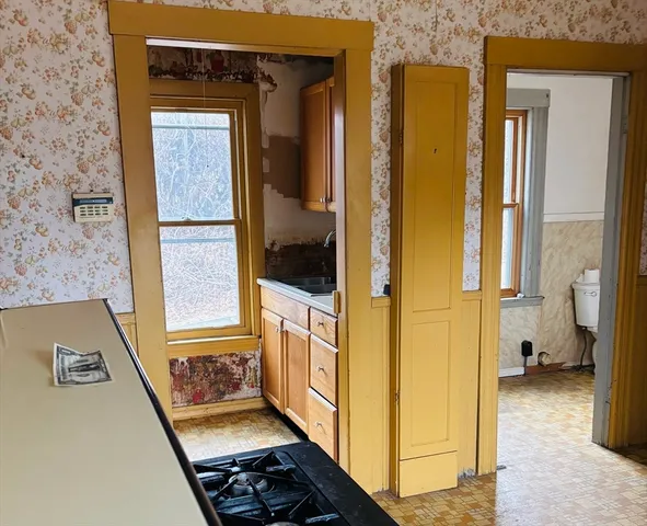 a view of a hallway with a living room
