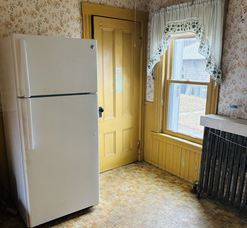 316 Amesbury Road Haverhill, MA 01830 - Photo 5 of 28 a view of a refrigerator in a kitchen