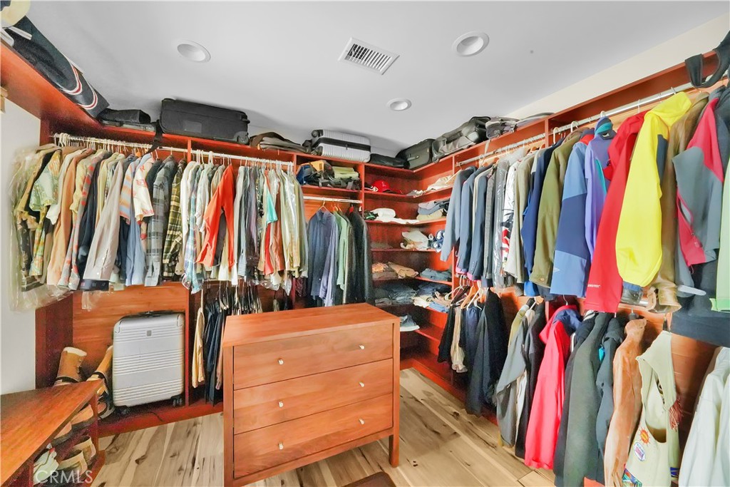 3064 Nestall Road Laguna Beach, CA 92651 - Photo 17 of 29 a view of walk in closet with clothes and shoes