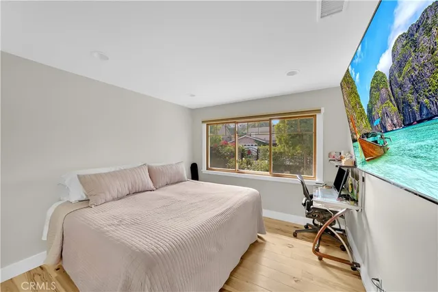 a bed room with a bed and a desk