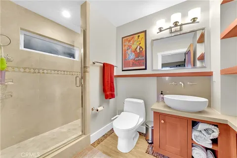 a bathroom with a toilet sink and shower