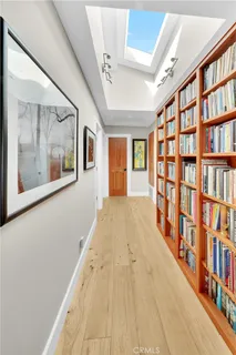 a view of an entryway with wooden floor and door