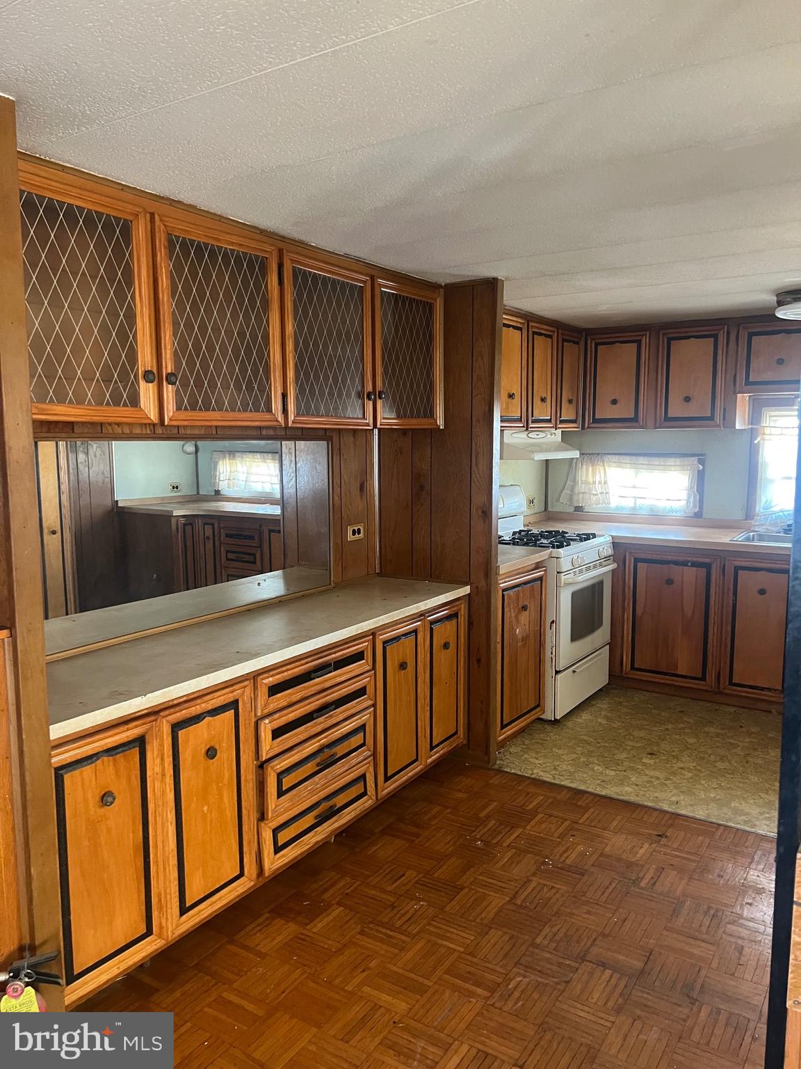 1302 Gibson Road, Unit 152 Bensalem, PA 19020 - Photo 3 of 17 a kitchen with stainless steel appliances granite countertop a stove a sink and a refrigerator