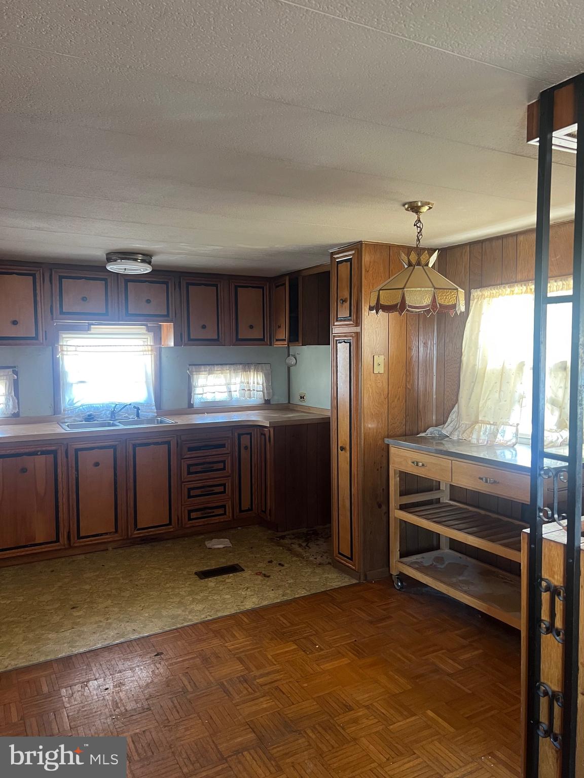 1302 Gibson Road, Unit 152 Bensalem, PA 19020 - Photo 4 of 17 a kitchen with stainless steel appliances kitchen island granite countertop a refrigerator and a stove