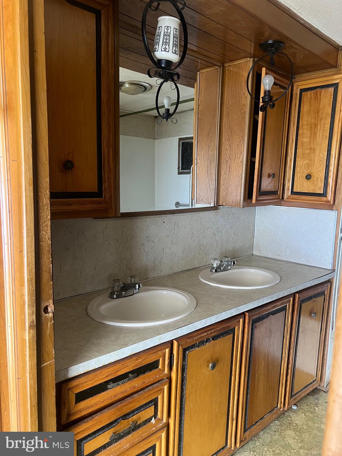 1302 Gibson Road, Unit 152 Bensalem, PA 19020 - Photo 10 of 17 a bathroom with a sink and a mirror