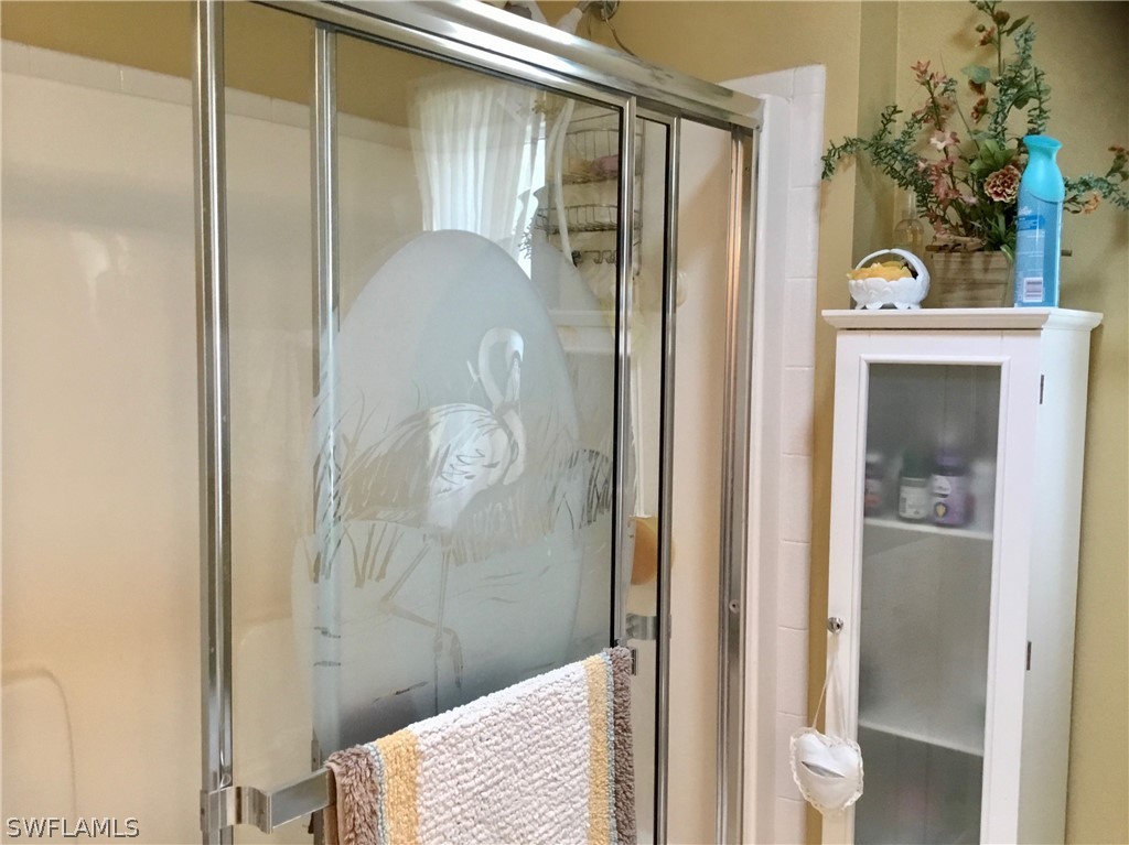 15550 Burnt Store Road, Unit 13 Punta Gorda, FL 33955 - Photo 17 of 30 a bathroom with a shower and a mirror