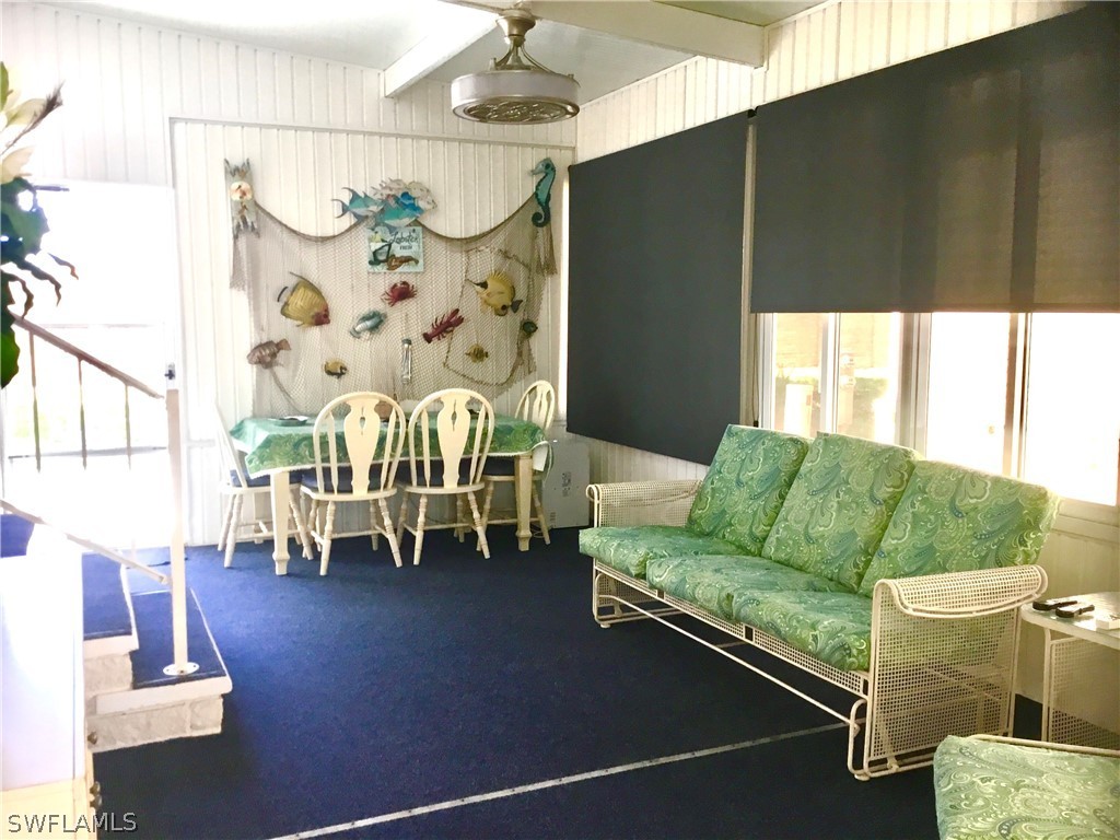 15550 Burnt Store Road, Unit 13 Punta Gorda, FL 33955 - Photo 23 of 30 a living room with furniture and a table