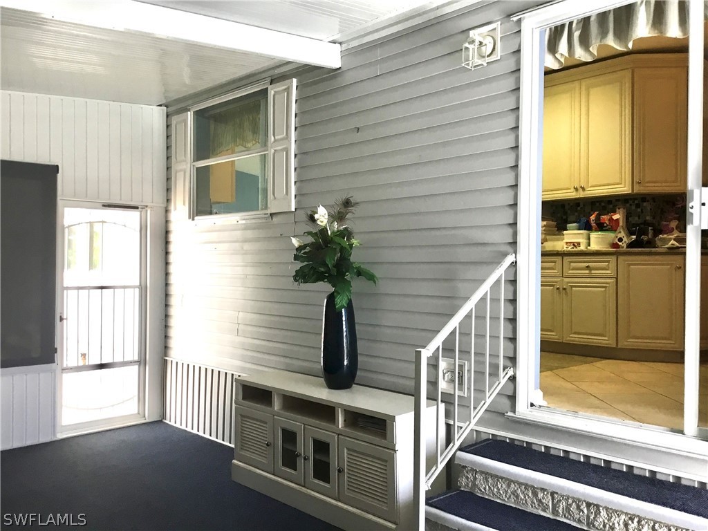 15550 Burnt Store Road, Unit 13 Punta Gorda, FL 33955 - Photo 25 of 30 a view of a kitchen with an outdoor space