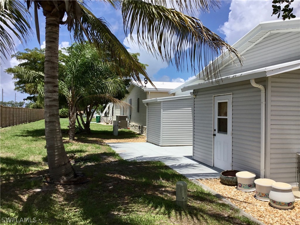 15550 Burnt Store Road, Unit 13 Punta Gorda, FL 33955 - Photo 27 of 30 a view of a back yard of the house
