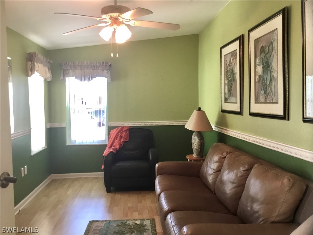 15550 Burnt Store Road, Unit 13 Punta Gorda, FL 33955 - Photo 6 of 30 a living room with furniture and a window