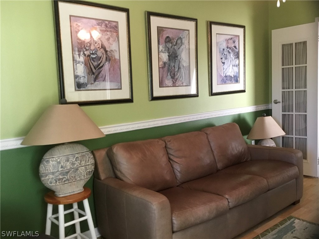 15550 Burnt Store Road, Unit 13 Punta Gorda, FL 33955 - Photo 7 of 30 a living room with furniture and a large window