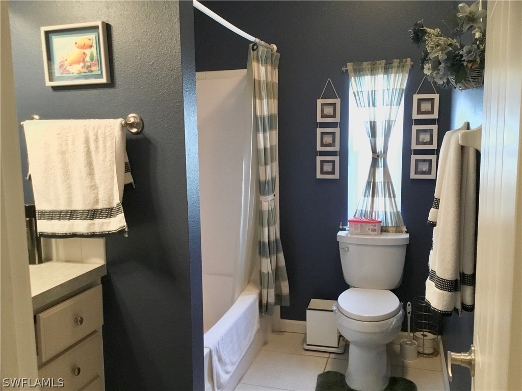 15550 Burnt Store Road, Unit 13 Punta Gorda, FL 33955 - Photo 9 of 30 a bathroom with a toilet and a shower