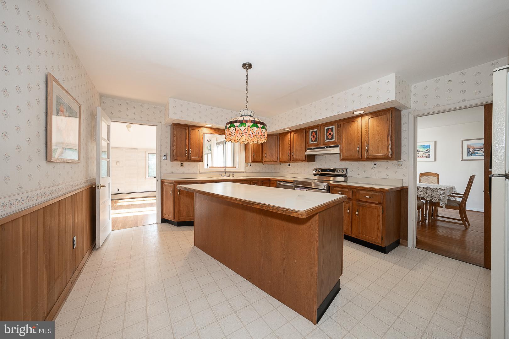 11 Tenby Road Havertown, PA 19083 - Photo 11 of 57 a kitchen with stainless steel appliances granite countertop a stove and a sink