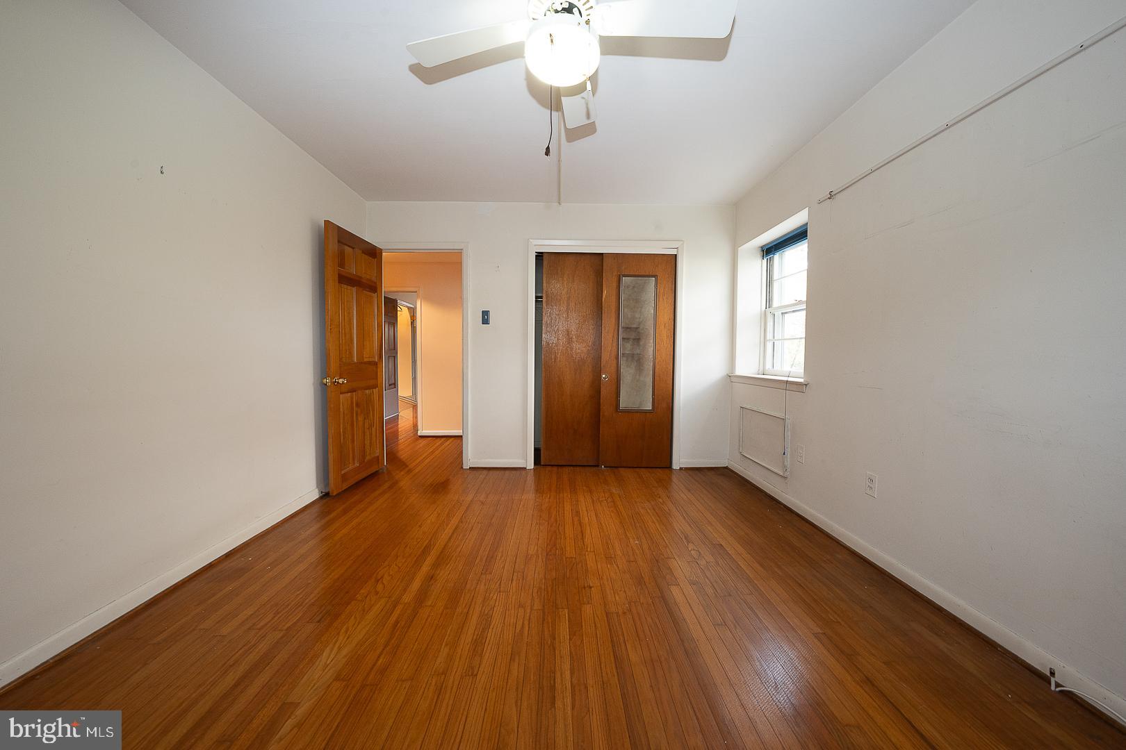 11 Tenby Road Havertown, PA 19083 - Photo 20 of 57 a view of an empty room with wooden floor and a window