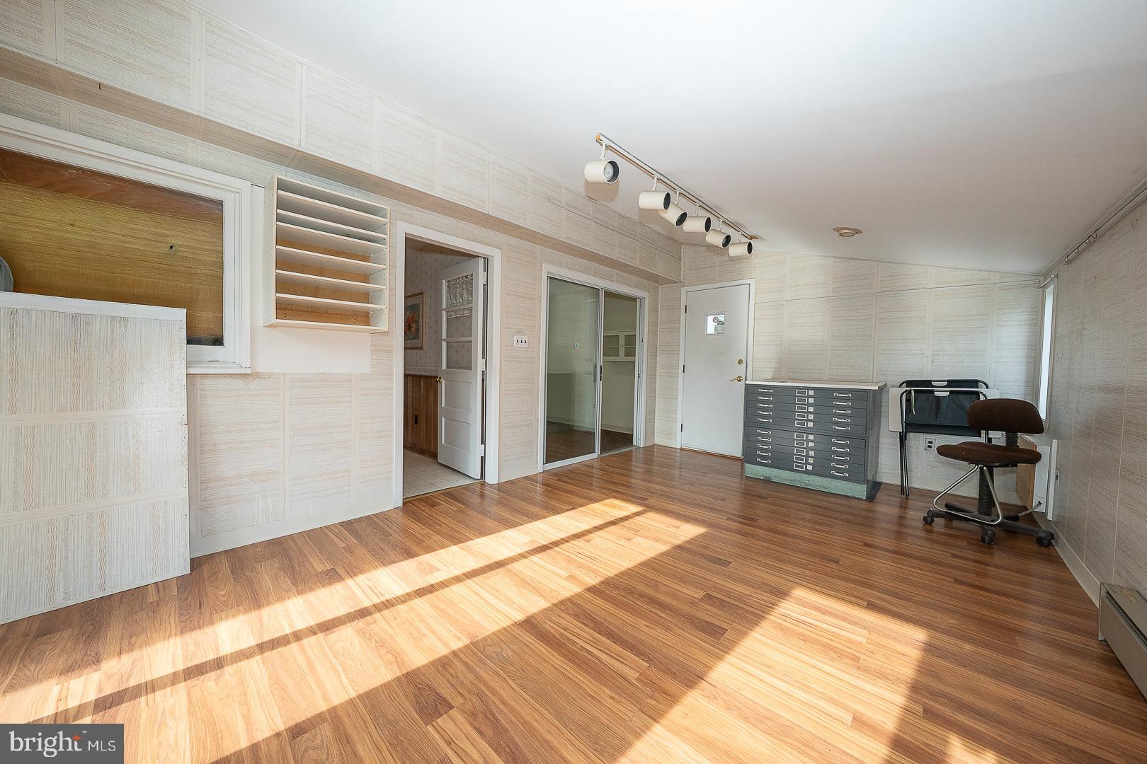 11 Tenby Road Havertown, PA 19083 - Photo 23 of 57 a view of a bedroom with wooden floor and furniture