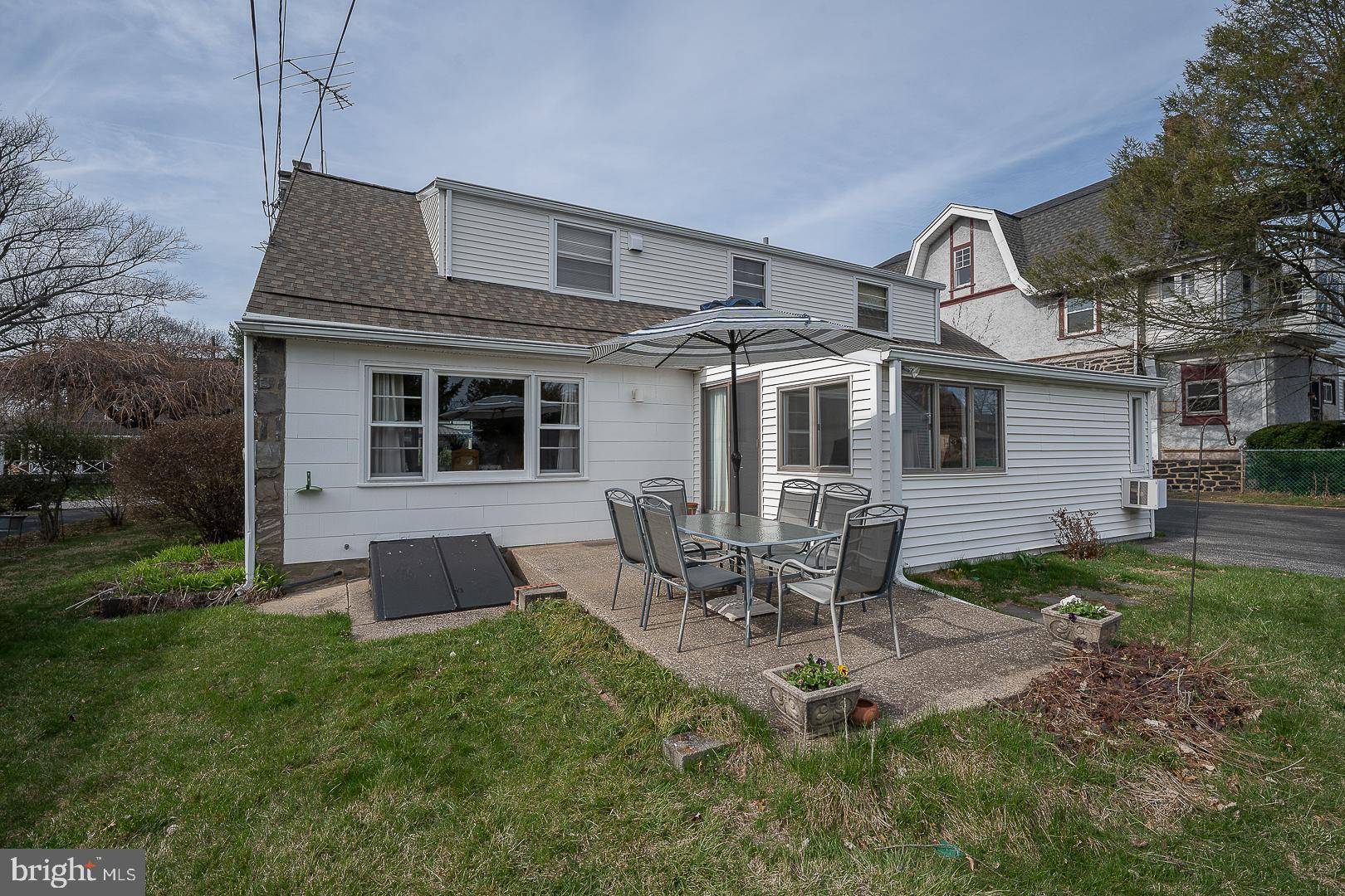 11 Tenby Road Havertown, PA 19083 - Photo 46 of 57 a backyard of a house with table and chairs