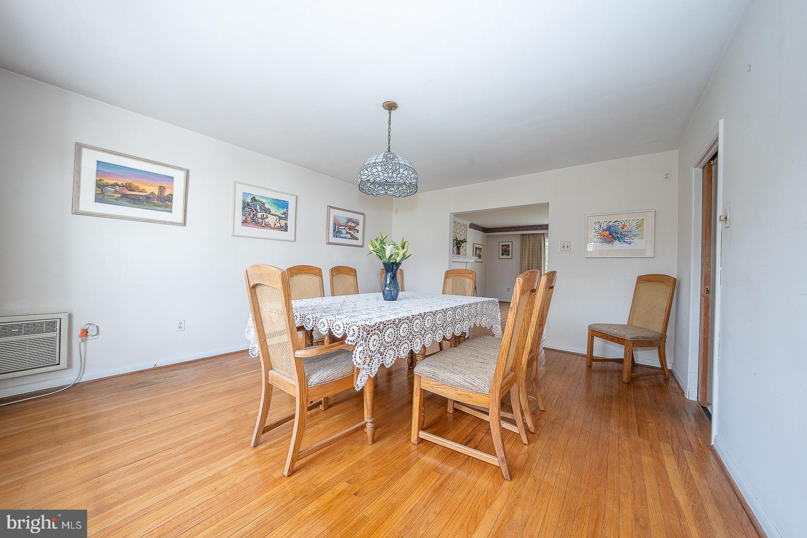 11 Tenby Road Havertown, PA 19083 - Photo 9 of 57 a dining room with furniture a chandelier and wooden floor