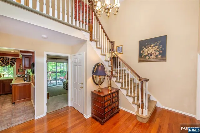 a view of staircase with furniture and a window