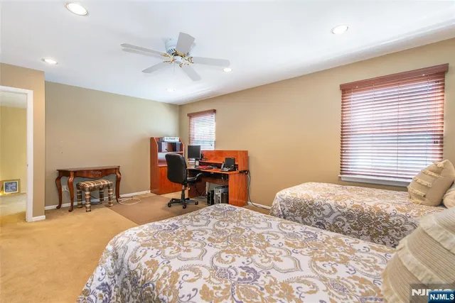 a bed room with a bed and a chair