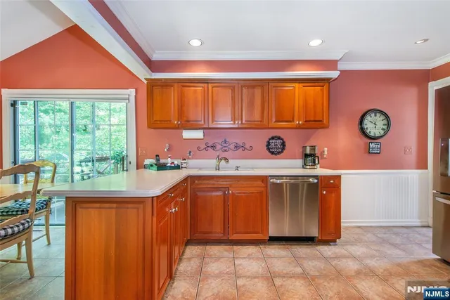 a kitchen with a window a sink and a stove