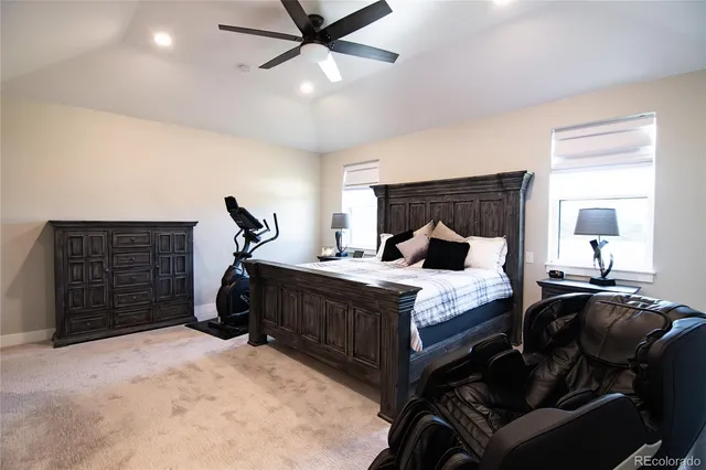 a bedroom with bed and wooden floor