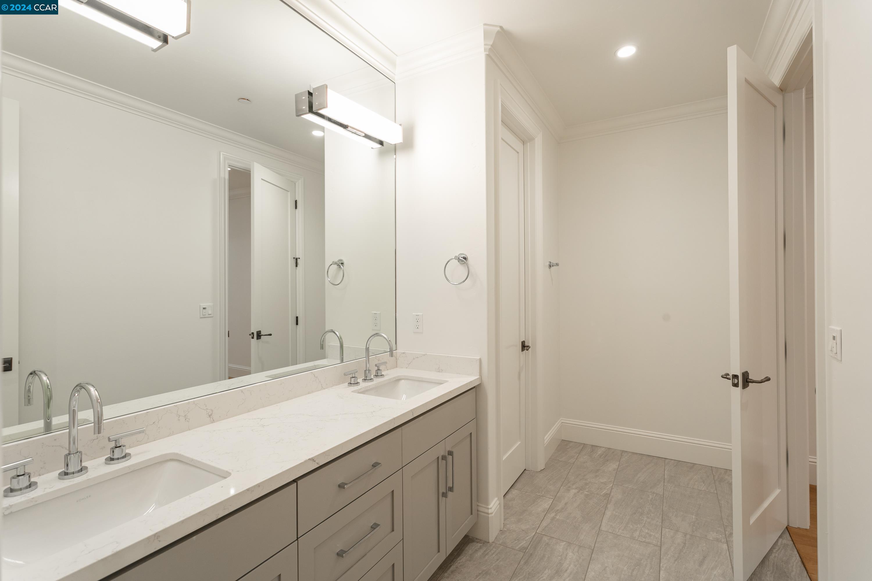 962 Reliez Station Lane Lafayette, CA 94549 - Photo 16 of 25 a bathroom with a double vanity sink a mirror and a shower