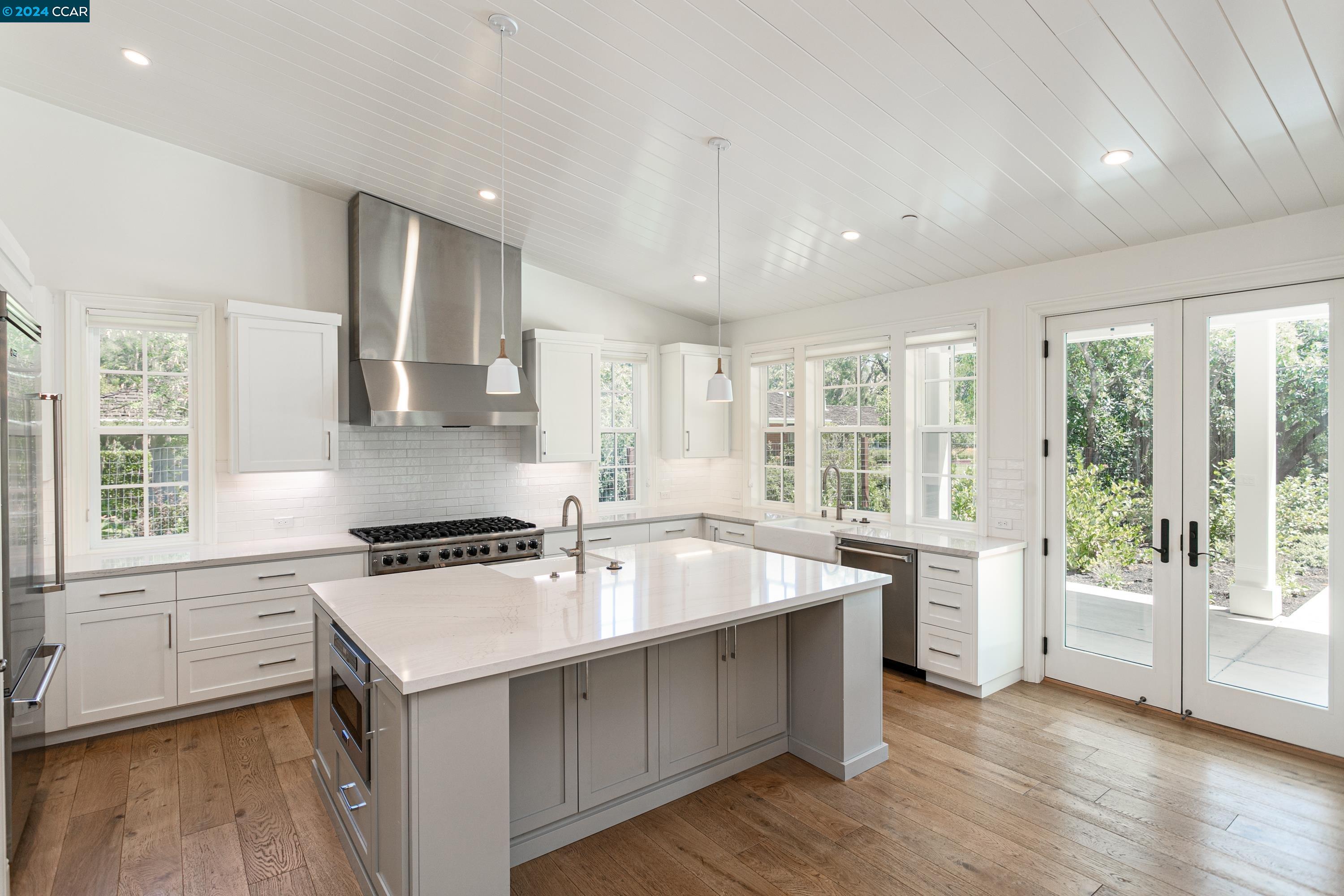 962 Reliez Station Lane Lafayette, CA 94549 - Photo 6 of 25 a kitchen with a stove a sink and a refrigerator