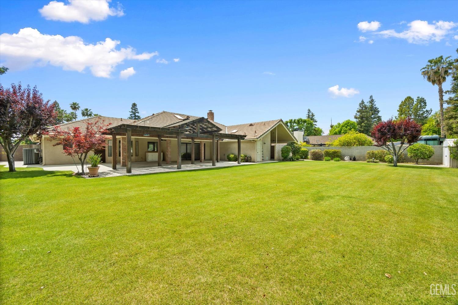 Undisclosed Address Bakersfield, CA 93309 - Photo 13 of 15 a view of a house with a big yard
