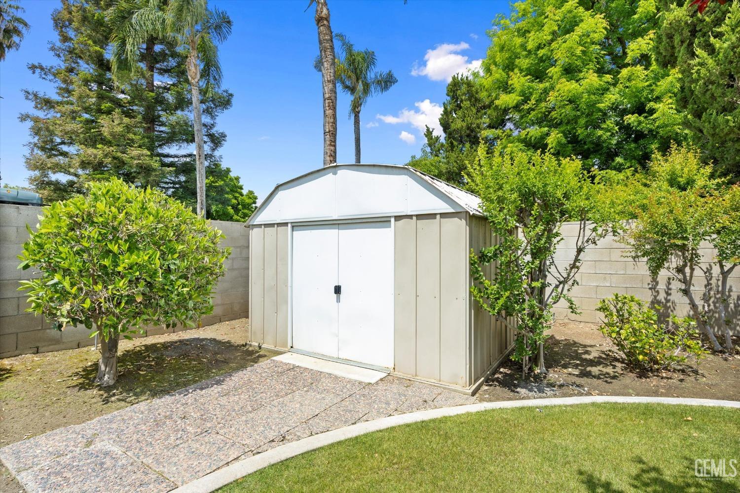 Undisclosed Address Bakersfield, CA 93309 - Photo 15 of 15 a front view of a house with garden