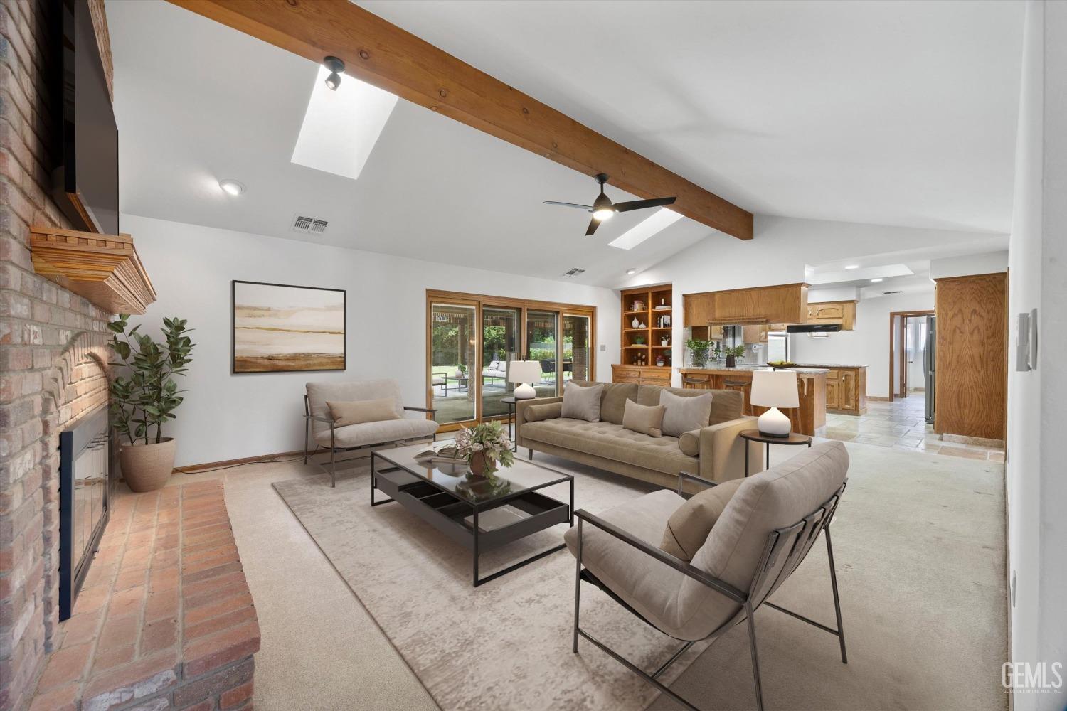 Undisclosed Address Bakersfield, CA 93309 - Photo 4 of 15 a living room with furniture and a flat screen tv