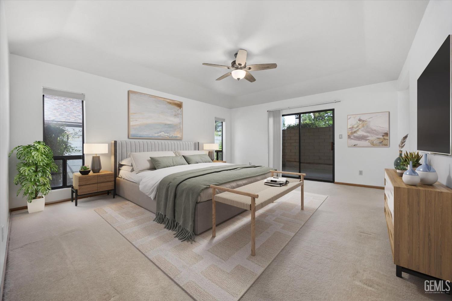 Undisclosed Address Bakersfield, CA 93309 - Photo 5 of 15 a spacious bedroom with a bed and a flat screen tv