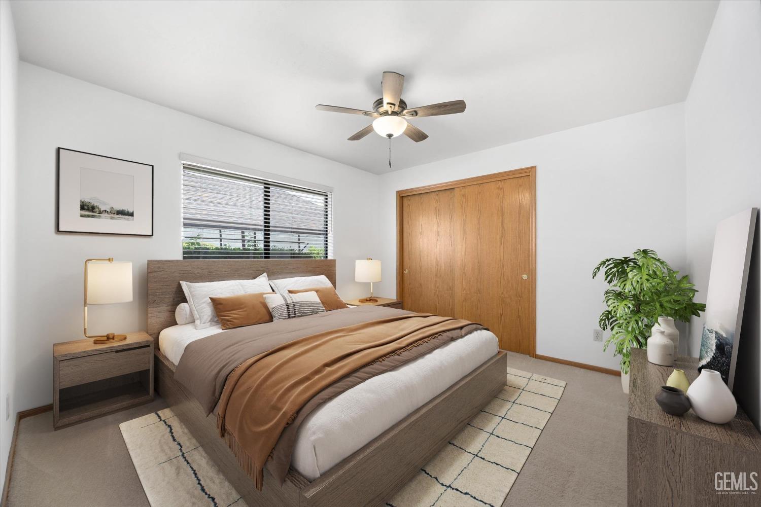 Undisclosed Address Bakersfield, CA 93309 - Photo 7 of 15 a bedroom with a bed and a potted plant