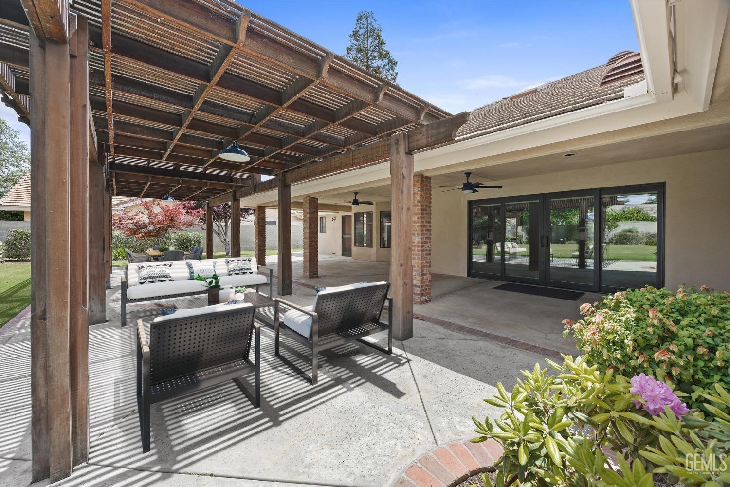 Undisclosed Address Bakersfield, CA 93309 - Photo 8 of 15 a building outdoor space with patio furniture and potted plants