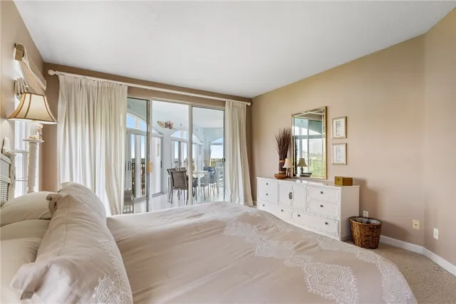 a bed room with a bed and a large window