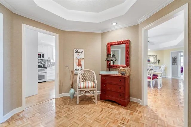 a living room with furniture and a dresser