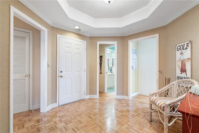 a view of a bedroom with a bed and glass door