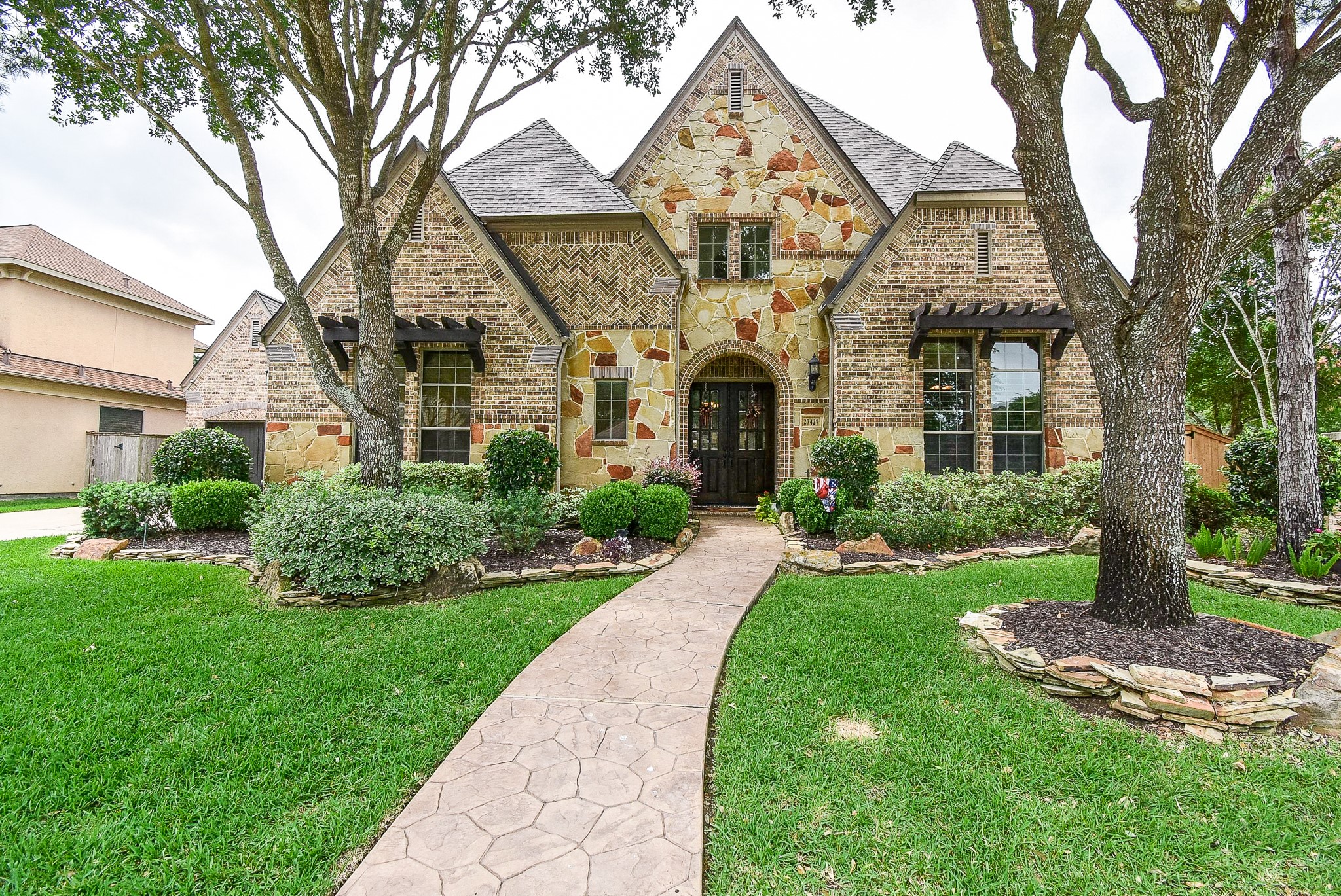 27427 Guthrie Ridge Lane Katy, TX 77494 - Photo 2 of 48 a front view of a house with garden