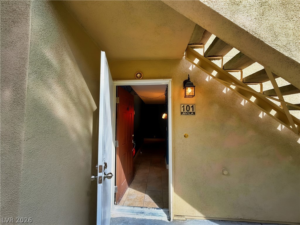 1852 North Decatur Boulevard, Unit 101 Las Vegas, NV 89108 - Photo 28 of 45 A private ground-floor entrance sits tucked beneath an outdoor staircase.
