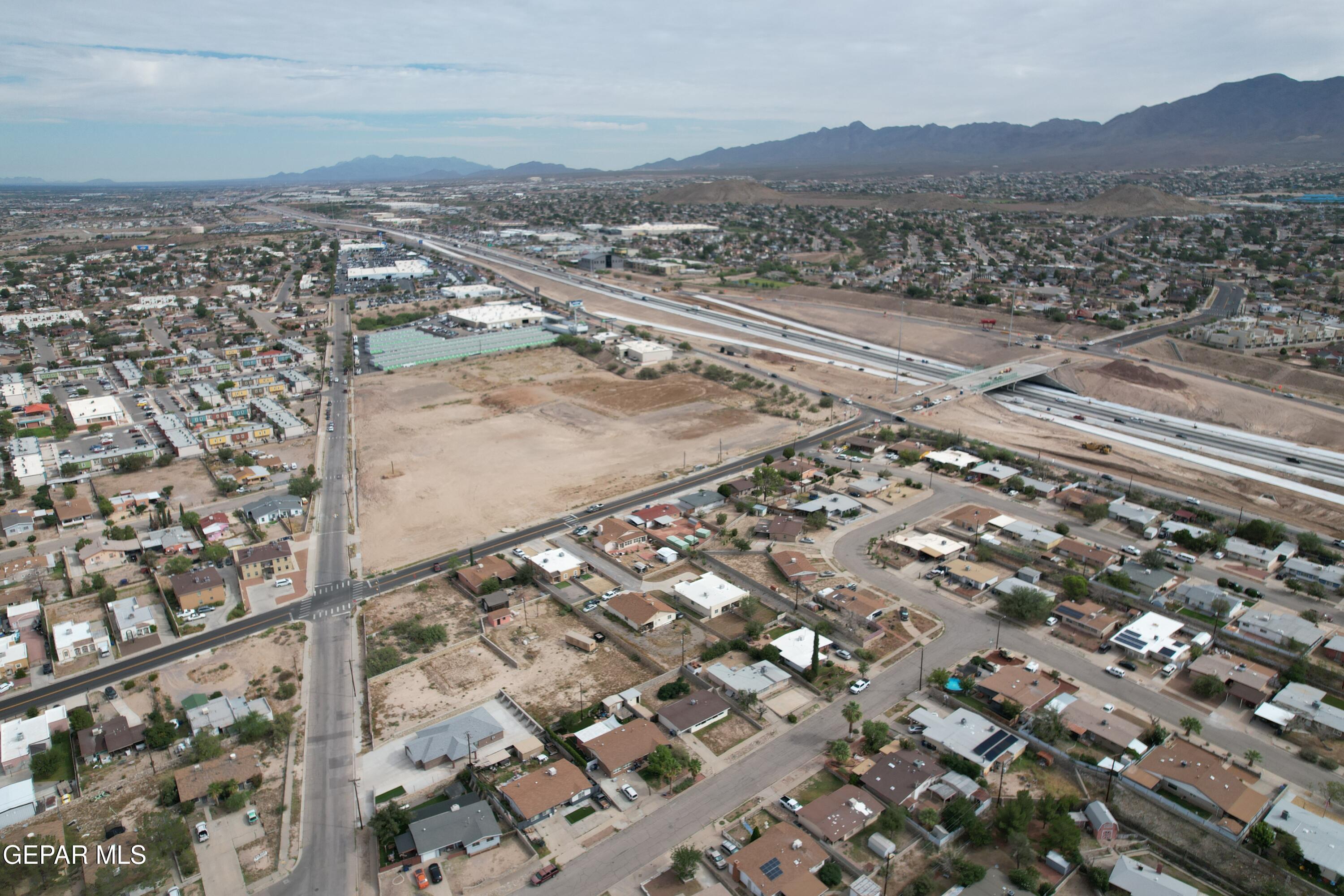 5354 Ridge Street El Paso, TX 79932 - Photo 4 of 8 an aerial view of residential houses with outdoor space