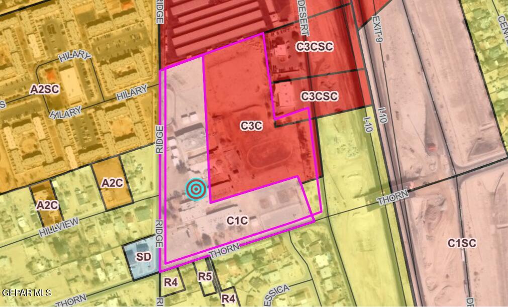 5354 Ridge Street El Paso, TX 79932 - Photo 6 of 8 a bed with a white comforter and pillows