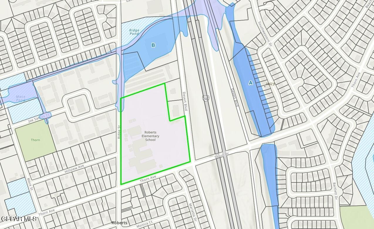 5354 Ridge Street El Paso, TX 79932 - Photo 7 of 8 staircase with white walls and a table