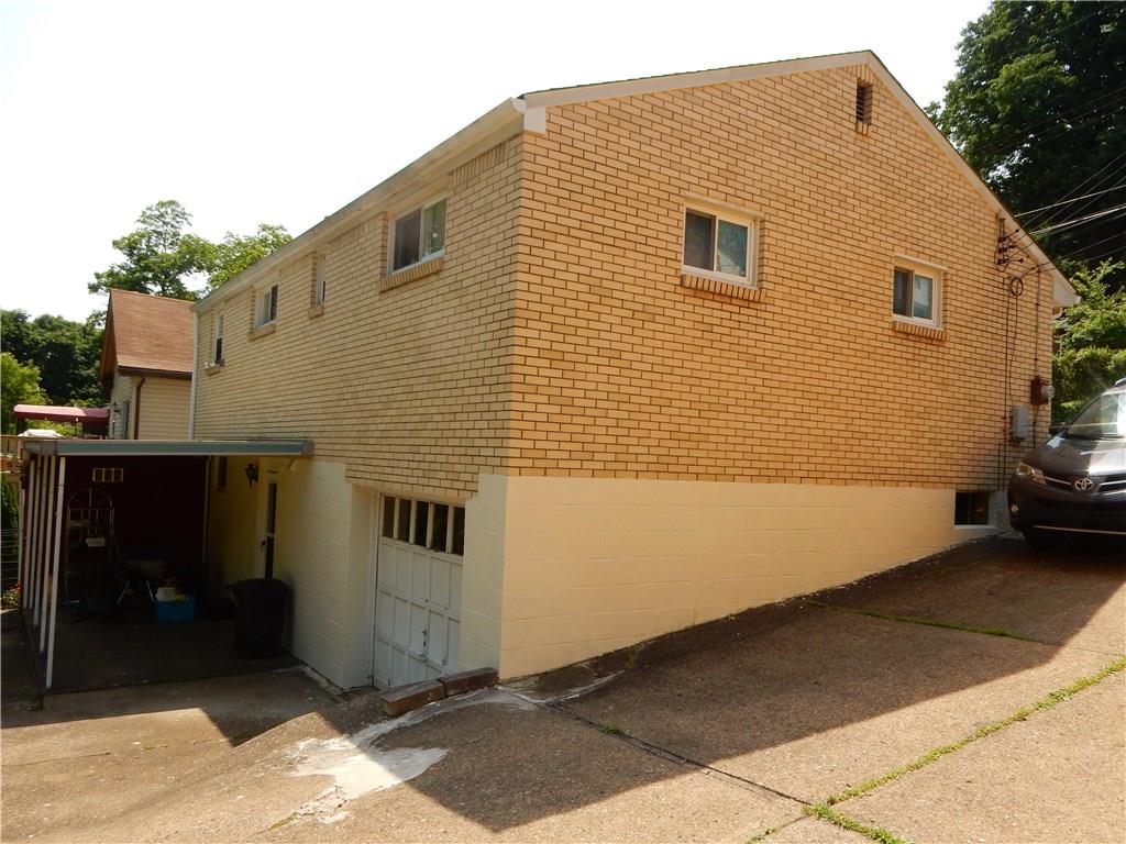 321 East Garden Road Pittsburgh, PA 15227 - Photo 4 of 20 The side of the home with the garage and covered patio