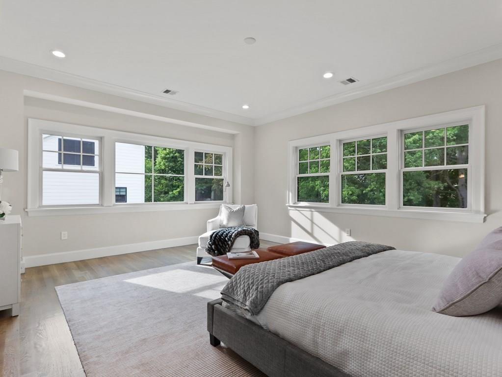 30 Columbine Road Newton, MA 02459 - Photo 20 of 35 a bed sitting in a spacious bedroom next to a window