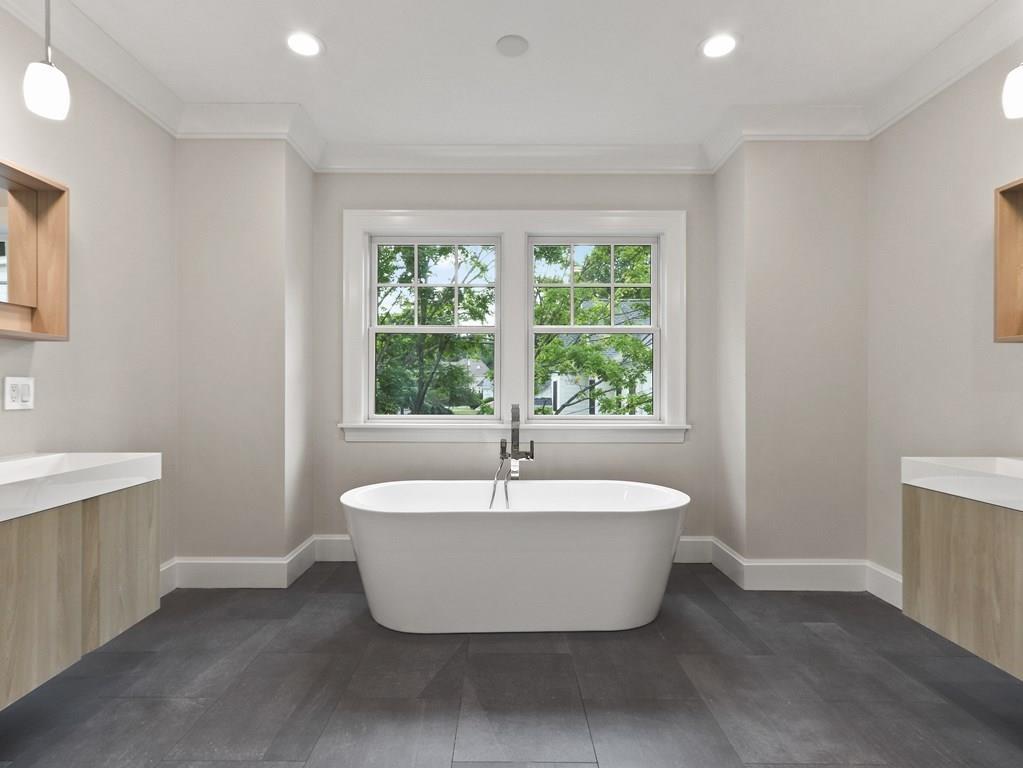 30 Columbine Road Newton, MA 02459 - Photo 22 of 35 a white bath tub sitting in a bathroom