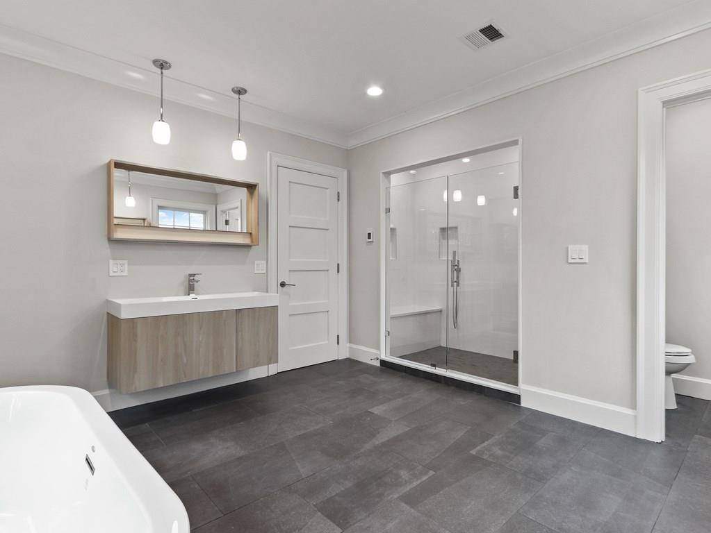 30 Columbine Road Newton, MA 02459 - Photo 23 of 35 a view of an empty room with window and cabinet