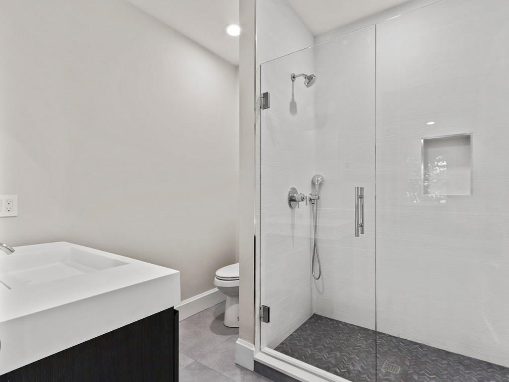 30 Columbine Road Newton, MA 02459 - Photo 28 of 35 a bathroom with a sink a toilet and shower